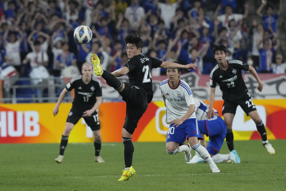 Ulsan Hyundai's Lee Gyu-sung tries to kick the ball against Yokohama F. Marinos during the first leg of the AFC Champions League semifinal soccer match at the Ulsan Munsu Football Stadium in Ulsan, South Korea, Wednesday, April 17, 2024. (AP Photo/Ahn Young-joon)