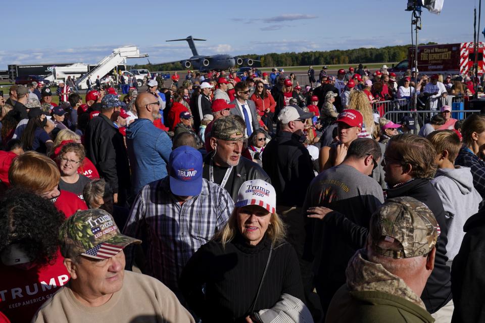 Supporters arrive for a campaign rally with President Donald Trump at the Central Wisconsin Airport Thursday, Sept. 17, 2020, in Mosinee, Wis. (AP Photo/Morry Gash)