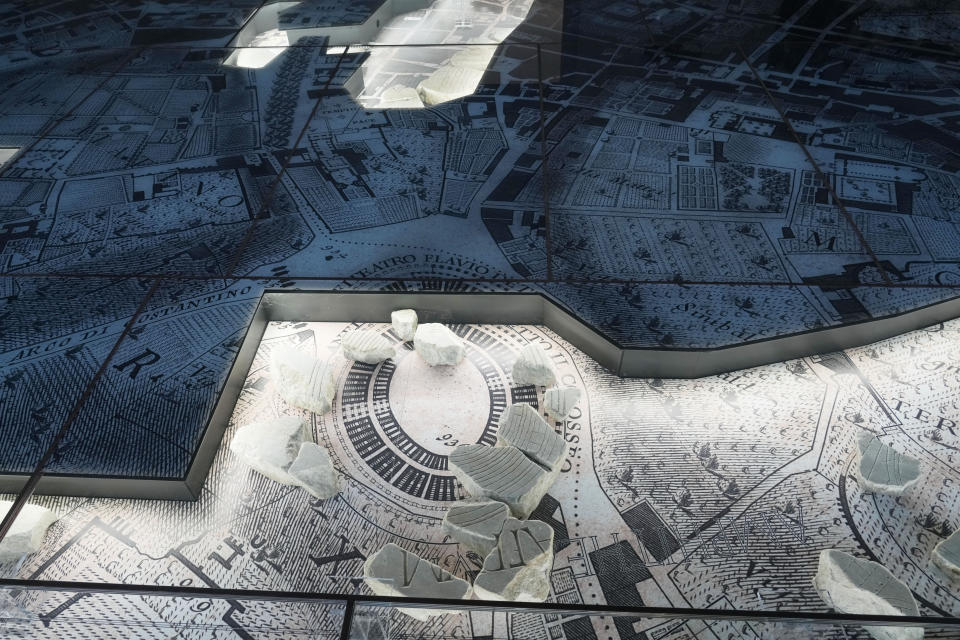 The giant marble map (Forma Urbis Romae) of the ancient Rome is shown to the media in the Archaeological Park of Mount Celio Museum overlooking the Colosseum in Rome, Thursday, Jan. 11, 2024. The giant map of Rome was done under Emperor Septimius Severus in 203 A.D. The map is 18 meters by 13 meters. (AP Photo/Gregorio Borgia)