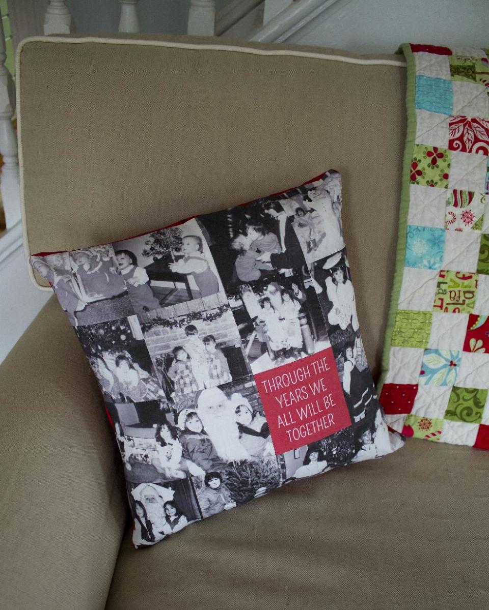 This photo taken on Dec. 2, 2013 shows a pillow decorated for the holidays. Instead of huddling around a photo album, put your pictures on display by turning them into holiday decorations. The holidays are a great time to pull out the old photos and reminisce, but there's no need to huddle around a dusty album. (AP Photo/Holly Ramer)