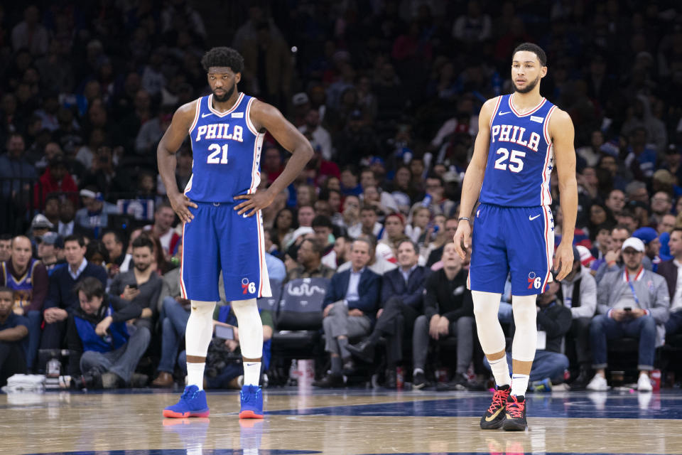 PHILADELPHIA, PA - DECEMBER 02: Joel Embiid #21 and Ben Simmons #25 of the Philadelphia 76ers look on against the Utah Jazz at the Wells Fargo Center on December 2, 2019 in Philadelphia, Pennsylvania. NOTE TO USER: User expressly acknowledges and agrees that, by downloading and/or using this photograph, user is consenting to the terms and conditions of the Getty Images License Agreement. (Photo by Mitchell Leff/Getty Images)