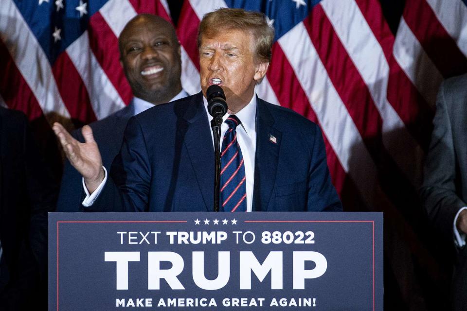 <p>Al Drago/Bloomberg via Getty</p> Donald Trump speaks to New Hampshire voters on Jan. 23, 2024, as running mate shortlister Tim Scott stands behind him