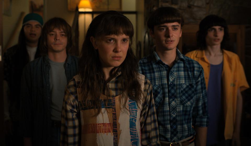 (L to R) Eduardo Franco as Argyle, Charlie Heaton as Jonathan, Millie Bobby Brown as Eleven, Noah Schnapp as Will Byers, and Finn Wolfhard as Mike Wheeler in Netflix’s “Stranger Things.” - Credit: Netflix