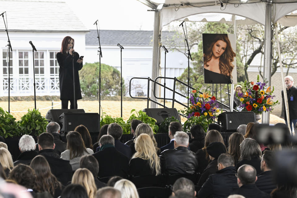 Priscilla Presley reads a poem wrtitten by granddaughter Harper Lockwood during a memorial service for her daughter Lisa Marie Presley at Graceland Sunday, Jan. 22, 2023, in Memphis, Tenn. Lisa Marie died Jan. 12 after being hospitalized for a medical emergency and was buried on the property next to her son Benjamin Keough, and near her father Elvis Presley and his two parents. (AP Photo/John Amis)
