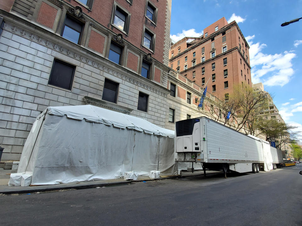 Pictured is a makeshift morgue on a road outside Lenox Hill Hospital.