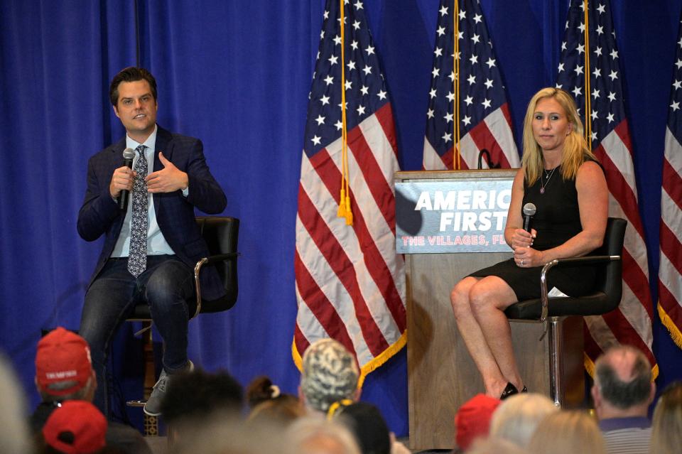 Rep. Matt Gaetz, R-Fla., and Rep. Marjorie Taylor Greene, R-Ga., address attendees during a rally May 7 in the Villages, Fla.