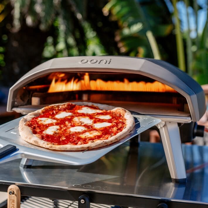 From rolling out the dough and adding toppings to watching it cook over the flame, you'll enjoy the whole process. <br /><br /><strong>Promising review:</strong> "We've wanted a pizza oven for a long time. The regular oven only gets to about 550F and the BBQ doesn't cook the top of the pizza well enough. Then this amazing thing comes along. It delivers as promised. Read to launch pizzas in 20 minutes. In fact I found that lower than max temp worked perfectly and avoided the over-charred crust. The 16-inch size is nice to allow room to maneuver 12-13" pies around to cook them evenly. I used the provided dough recipe with success so far. I look forward to trying some other crust types. I<strong>f you are on the fence about this, listen: Buy it!</strong> Nothing easier than gas. Pizzas on my second try came as good as the best restaurant pizzas I've had. Keep the toppings light and you will love it too." &mdash; <a href="https://go.skimresources.com?id=38395X987171&amp;xs=1&amp;url=https%3A%2F%2Fwww.williams-sonoma.com%2Fproducts%2Fooni-koda-16-pizza-oven%2F&amp;xcust=HPWantedKitchenGadgets6087326be4b09a22a4461b8c" target="_blank" rel="noopener noreferrer">matthekman</a><br /><br /><strong>Get it from Williams-Sonoma for <a href="https://go.skimresources.com?id=38395X987171&amp;xs=1&amp;url=https%3A%2F%2Fwww.williams-sonoma.com%2Fproducts%2Fooni-koda-16-pizza-oven%2F&amp;xcust=HPWantedKitchenGadgets6087326be4b09a22a4461b8c" target="_blank" rel="noopener noreferrer">$499.95</a>.</strong>