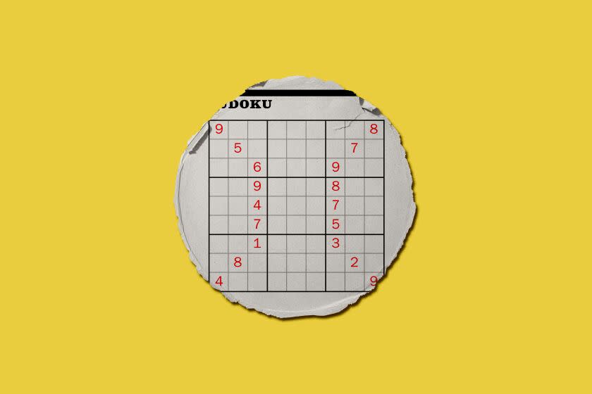 A circular piece of newspaper with a sudoku puzzle on it with red numbers in the shape of baseball seams