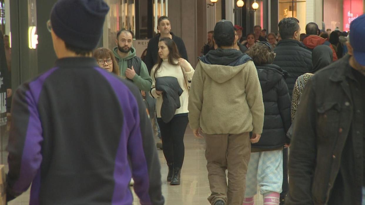 Boxing Day 2023 shoppers are seen at Sherway Gardens mall in Toronto.  (Martin Trainor/CBC - image credit)