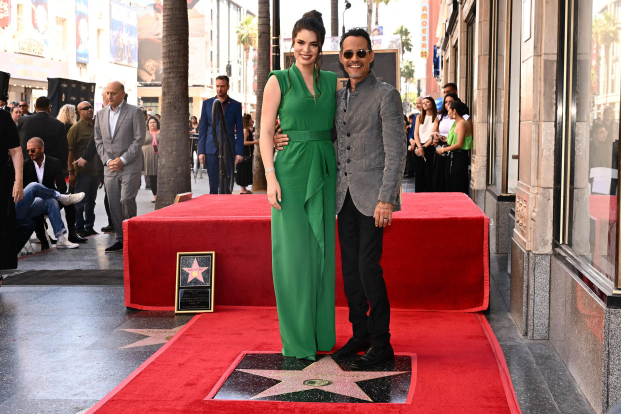 US singer Marc Anthony and his wife Paraguayan model Nadia Ferreira pose as he receives a star on the Hollywood Walk of Fame during a ceremony in Hollywood, California on September 7, 2023.  (Patrick T. Fallon / AFP via Getty Images)