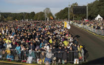 Faithful gather to follow Pope Francis' celebrating Holy Mass at the Confluence Park in Kaunas, Lithuania, Sunday, Sept. 23, 2018. Pope Francis is on the second of his two-day visit to Lithuania. (AP Photo/Mindaugas Kulbis)