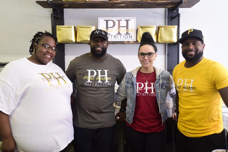 Shanelle Jackson (left), Clifton Jackson (middle), Lindsey Jackson (middle), and Matthew Browning (right) at Port Huron Nutrition located at 506 Quay Street in downtown Port Huron on Thursday, May 19, 2022.