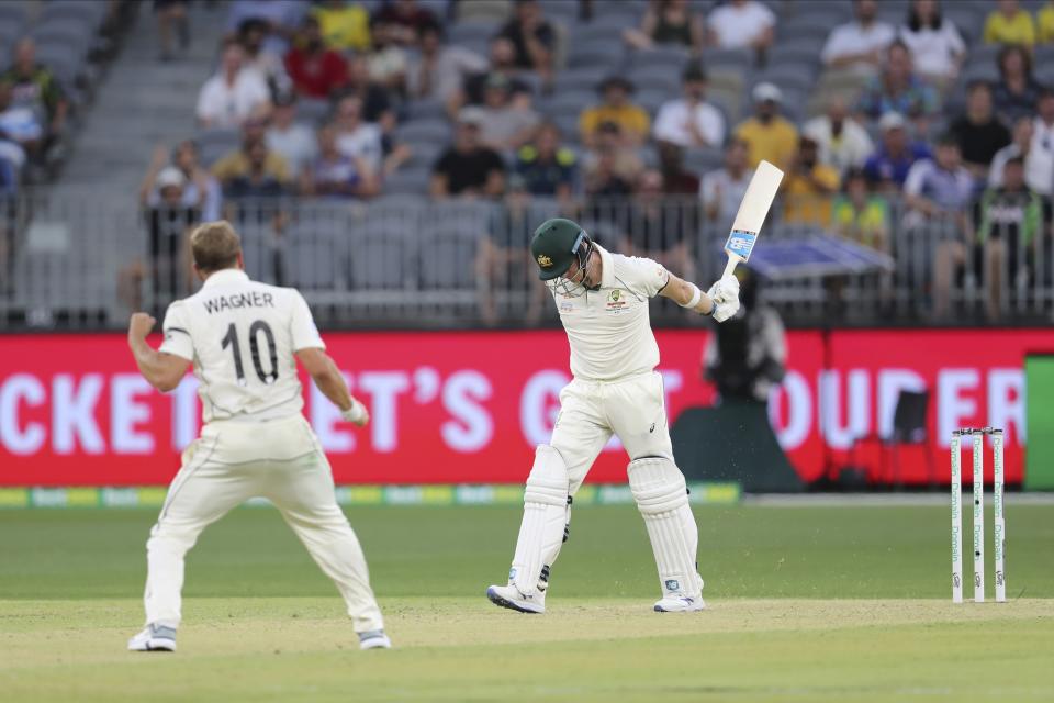 New Zealand's Neil Wagner, left, celebrates taking the wicket of Australia's Steve Smith during play in their cricket test in Perth, Australia, Thursday, Dec. 12, 2019. (AP Photo/Trevor Collens)