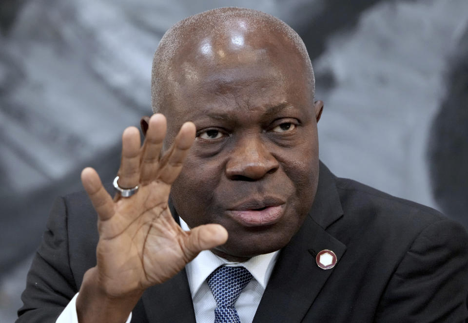 FILE - Gilbert Houngbo, Director General of the International Labour Organization (ILO), addresses the media during a press conference in Berlin, Germany, Tuesday, Nov. 29, 2022. Illegal profits from forced labor worldwide have risen to the “obscene” amount of $236 billion per year, the U.N. labor agency reported Tuesday, March 19, 2024, with sexual exploitation to blame for three-fourths of the take from a business that deprives migrants of money they can send home, swipes jobs from legal workers, and allows the criminals behind it to dodge taxe (AP Photo/Michael Sohn, File)