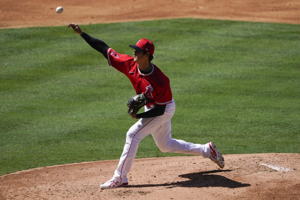 Los Angeles Angels' Shohei Ohtani pitches during an intrasquad game at baseball practice at Angel Stadium on Tuesday, July 7, 2020, in Anaheim, Calif. (AP Photo/Ashley Landis)