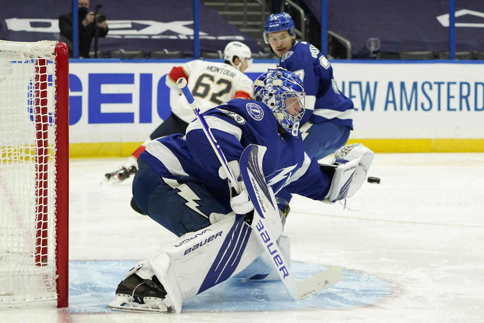 Tampa Bay Lightning goaltender Andrei Vasilevskiy (88) makes a save on a shot by the Florida Panthers during the first period in Game 6 of an NHL hockey Stanley Cup first-round playoff series Wednesday, May 26, 2021, in Tampa, Fla. (AP Photo/Chris O'Meara)