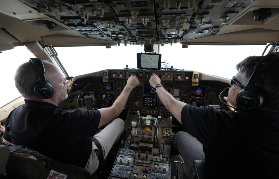 Honeywell test pilots Joe Duval, left, and Clint Coatney fly a Boeing 757 test aircraft demonstrating runway hazard warning systems over the airport in Tyler, Texas, Tuesday, June 4, 2024. (AP Photo/LM Otero)