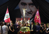 Archbishop Juan Luis Cipriani, Pilar Nores, former wife of Peru's former President Alan Garcia, family members and friends gather around the coffin during a wake, after Garcia fatally shot himself on Wednesday, in Lima, Peru April 18, 2019. REUTERS/Guadalupe Pardo