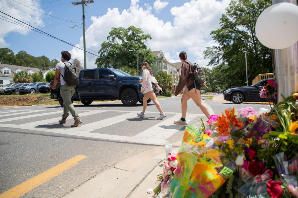 Florida State University students use the crosswalk at the intersection of Pensacola and Lorene Streets where sophomore Ellie Sims was struck and killed by a driver just earlier in the week, Wednesday, May 1, 2024.