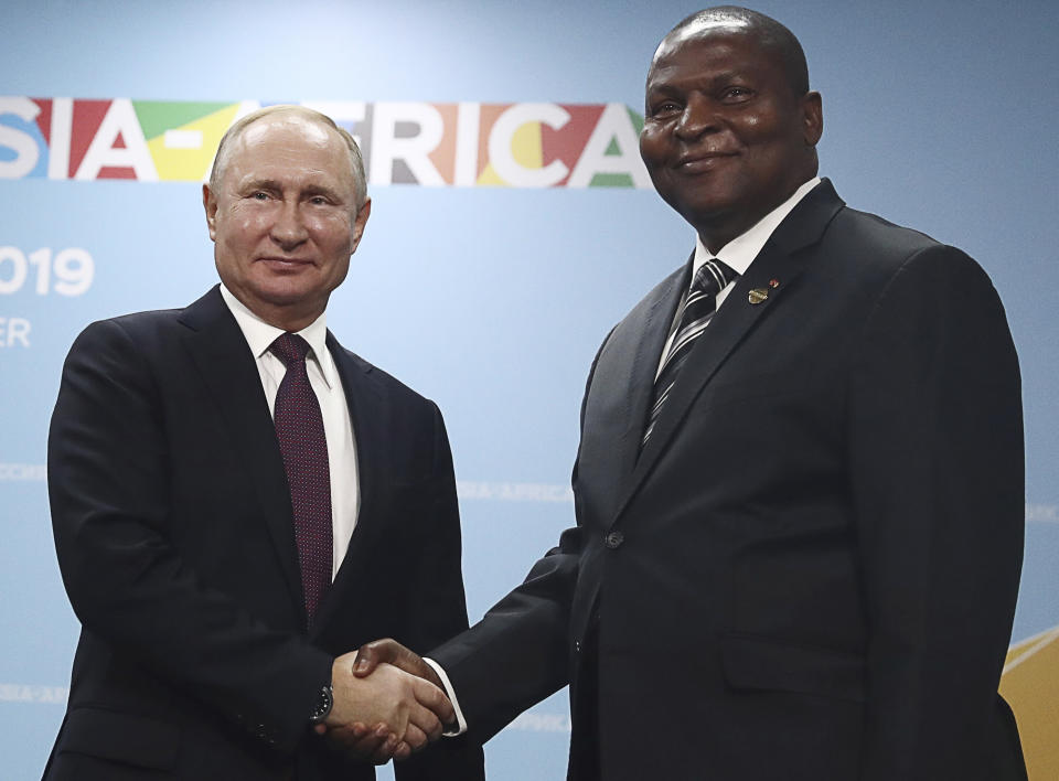 Russian President Vladimir Putin, left, and President of the Central African Republic Faustin Archange Touadera pose for a photo during their meeting on the sideline of Russia-Africa summit in the Black Sea resort of Sochi, Russia, Wednesday, Oct. 23, 2019. (Sergei Fadeyechev, TASS News Agency Pool Photo via AP)