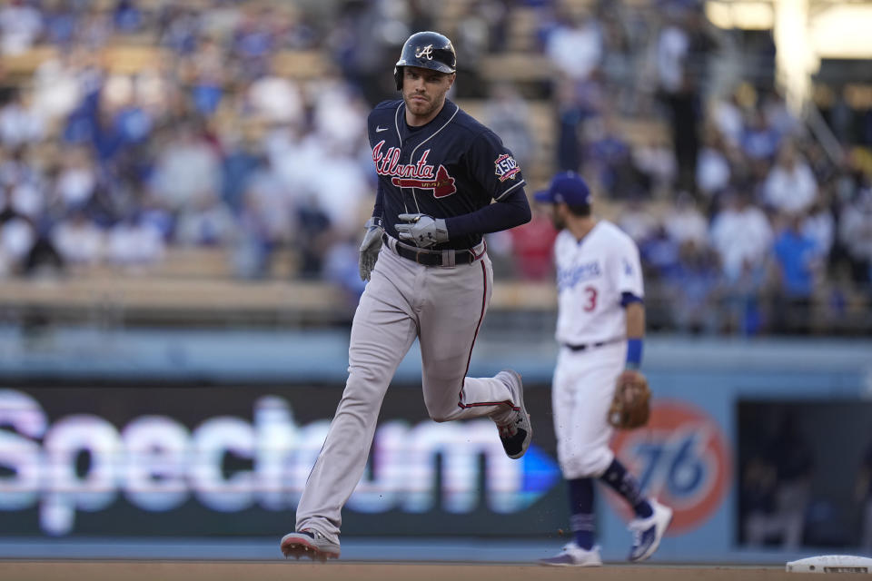 Atlanta Braves' Freddie Freeman runs the bases after hitting a two-run home run during the first inning against the Los Angeles Dodgers in Game 5 of baseball's National League Championship Series Thursday, Oct. 21, 2021, in Los Angeles. (AP Photo/Jae C. Hong)