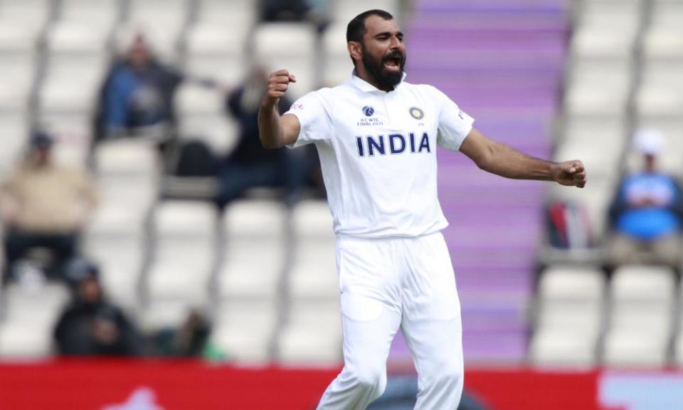 India’s Mohammed Shami celebrates taking the wicket of  New Zealand’s Colin de Grandhomme.