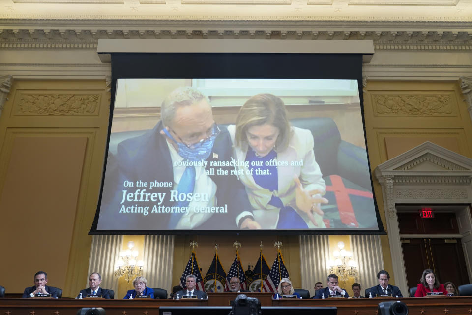 A video showing then-Senate Minority Leader Chuck Schumer of N.Y., and House Speaker Nancy Pelosi of Calif., talking withe then-acting Attorney General Jeffrey Rosen is played as the House select committee investigating the Jan. 6 attack on the U.S. Capitol holds a hearing on Capitol Hill in Washington, Thursday, Oct. 13, 2022. (AP Photo/Jacquelyn Martin)