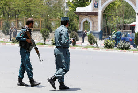 Afghan police officers keep watch at the site of a suicide attack in Kabul, Afghanistan June 4, 2018. REUTERS/Omar Sobhani