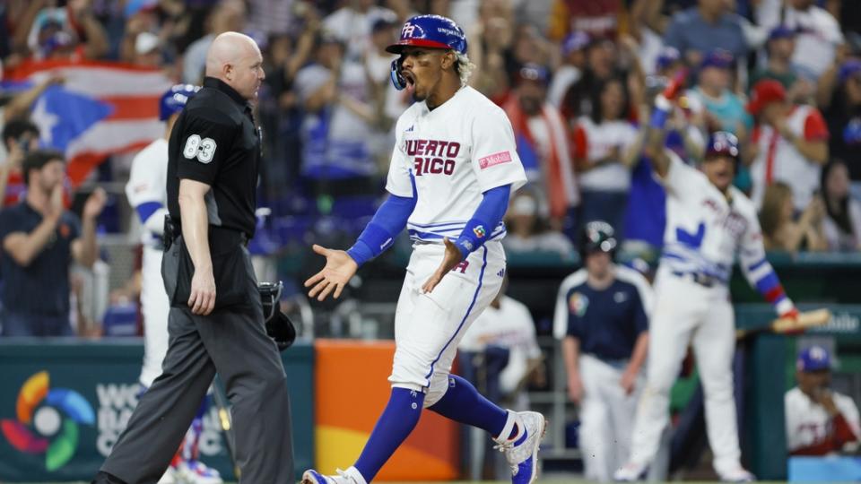 March 11, 2023;  Miami, FL, USA;  Puerto Rico shortstop Francisco Lindor (12) scores after a base hit by right fielder MJ Melendez (not pictured) in the fifth inning against Nicaragua at LoanDepot Park.