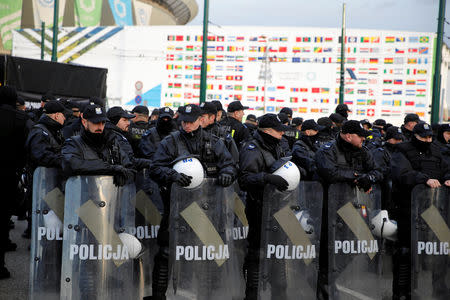 Policeman secure the venue, where the COP24 UN Climate Change Conference 2018 is held, during the March for the Climate on the streets of Katowice, Poland December 8, 2018. Agencja Gazeta/Grzegorz Celejewski via REUTERS