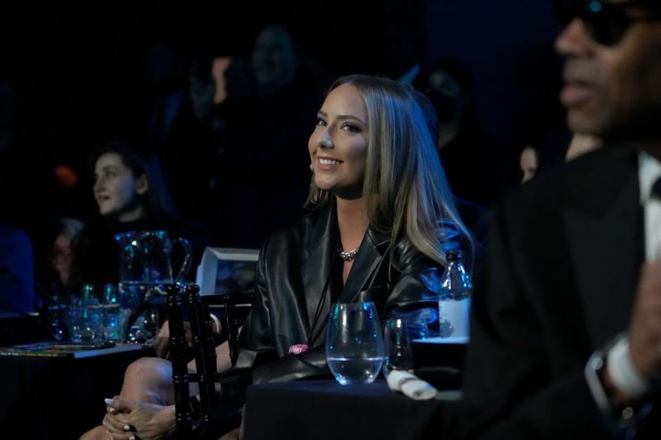 eminem's daughter hailie jade smiling as she sits at a table
