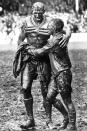 Rival captains Norm Provan and Arthur Summons came together in a momentary, muddy embrace at the end of the 1963 grand final. Captured in an iconic photograph, the moment of supreme sportsmanship now lives on in the form of the modern NRL trophy.
