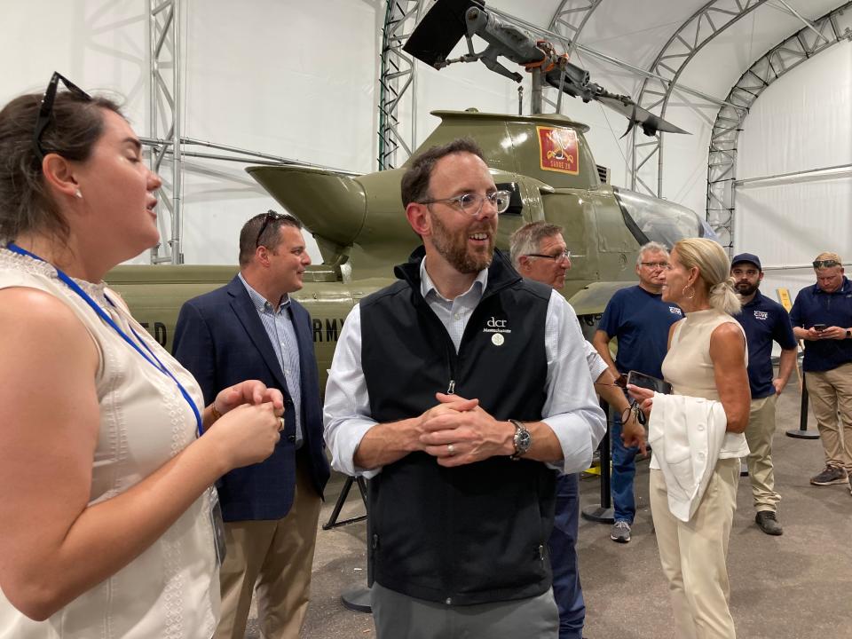 Battleship Cove Executive Director Meghan Rathbun, left, leads Department of Conservation and Recreation Commissioner Brian Arrigo on his first tour of Battleship Cove in Fall River on Aug. 8, 2023.