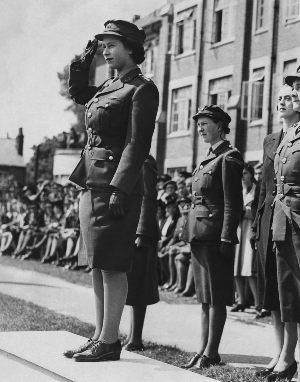 Princess Elizabeth takes the salute during a march-past of Auxiliary Territorial Service cadets at the Imperial Services College, Windsor, 14th June 1946. (Getty Images)