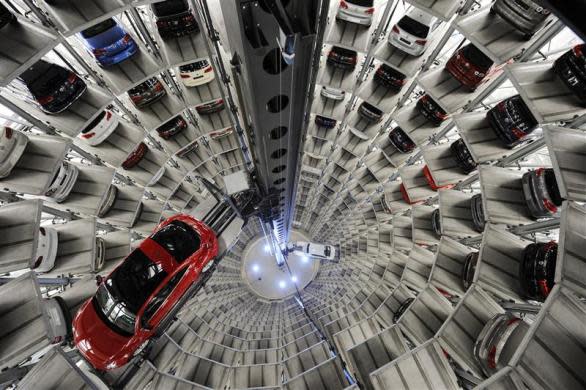 A Volkswagen "Beetle" (L) and an "UP!" are pictured in a delivery tower at the company's headquarter in Wolfsburg, Germany March 12, 2012.