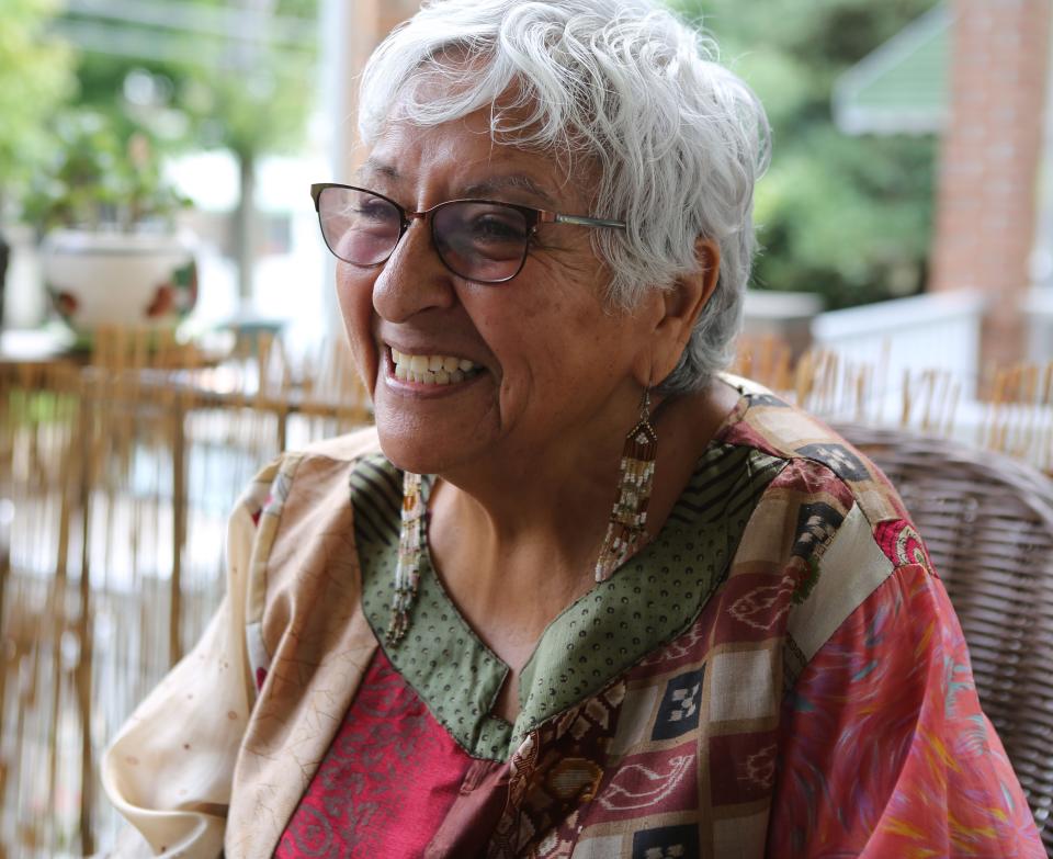 Genoveva Pitts, the founder of the Peoples Festival, smiles while sharing stories of Bob Marley's time spent in Wilmington.