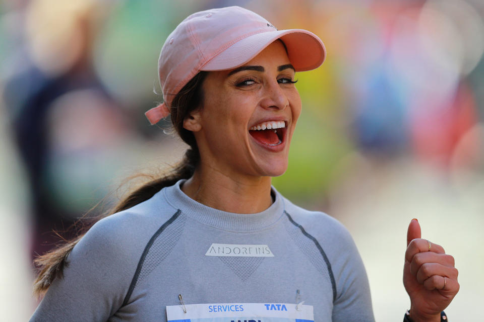 Despite running 16 miles in three boroughs this runner smiles while running up First Avenue during the 2019 New York City Marathon. (Photo: Gordon Donovan/Yahoo News)