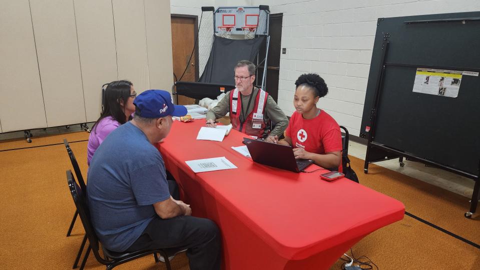 Members of the Red Cross gather information at an emergency assistance center in Borger.