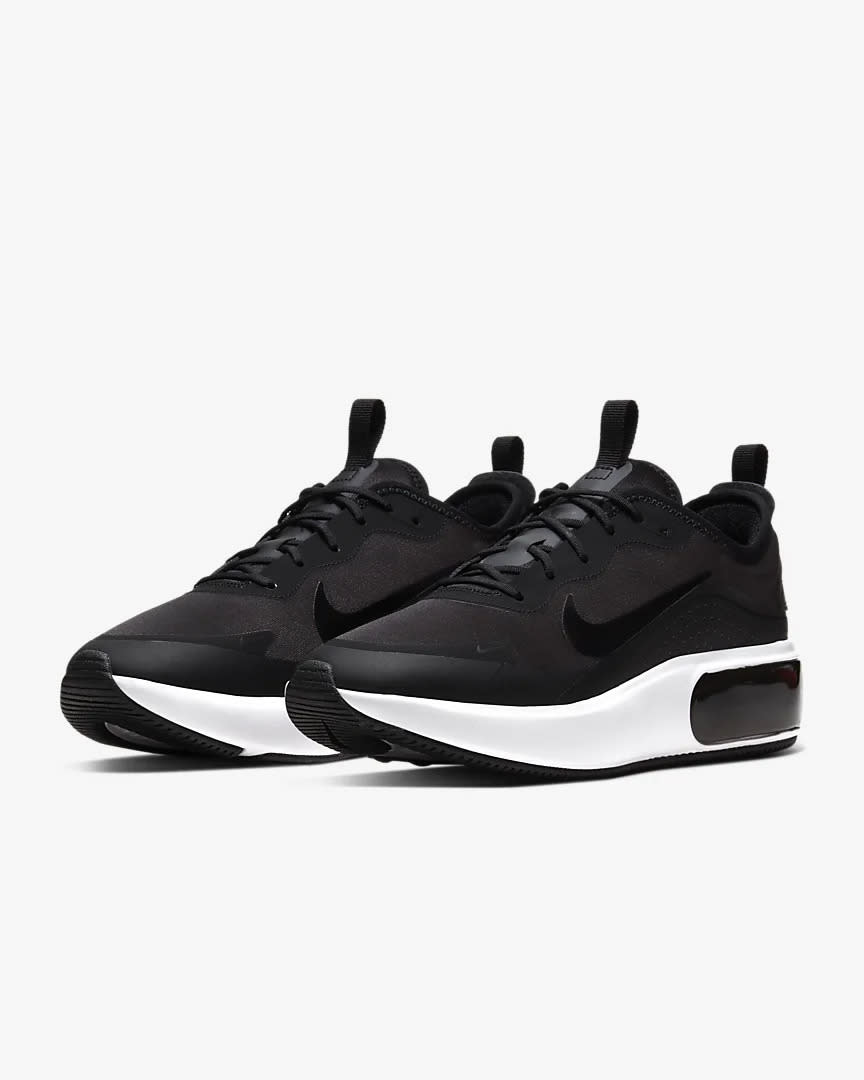 Black Nike Air Max shoes with white sole