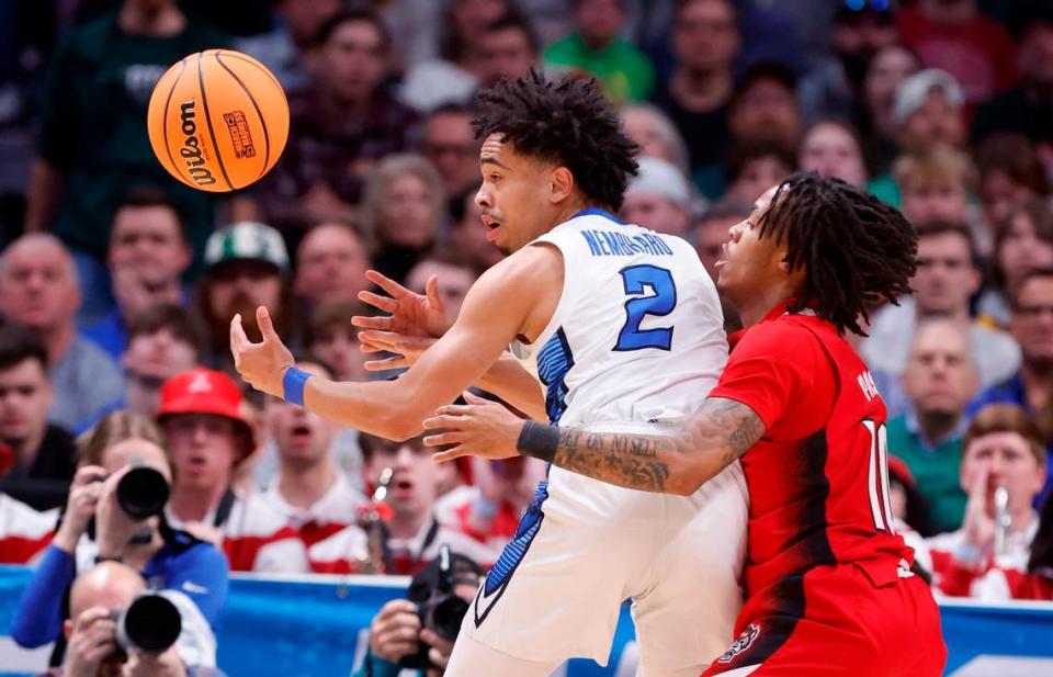 N.C. State’s Breon Pass (10) defends Creighton’s Ryan Nembhard (2) during the first half of N.C. State’s game against Creighton in the first round of the NCAA Tournament at Ball Arena in Denver, Colo., Friday, March 17, 2023. Ethan Hyman/ehyman@newsobserver.com