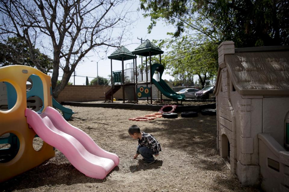 In this April 14, 2014 photo, a 3-year-old boy plays in the playground at Community Day Preschool of Garden Grove in Garden Grove, Calif. According to the school's executive director Sue Puisis, the enrollment at the preschool has dropped by more than 50 percent since 2008. The financial crisis that followed the collapse of U.S. investment bank Lehman Brothers in 2008 sent birth rates tumbling around the world as couples found themselves too short of money or too fearful about their finances to have children. Six years later, birth rates haven't bounced back. (AP Photo/Jae C. Hong)