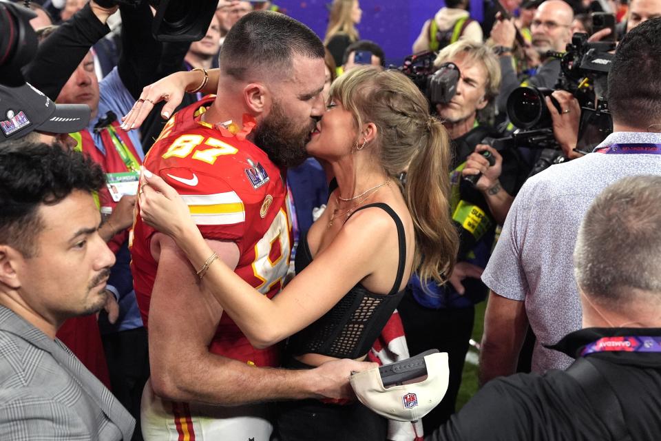 Taylor Swift kisses Kansas City Chiefs tight end Travis Kelce after the NFL Super Bowl 58 football game against the San Francisco 49ers, Sunday, Feb. 11, 2024, in Las Vegas. The Chiefs won 25-22. (AP Photo/John Locher)