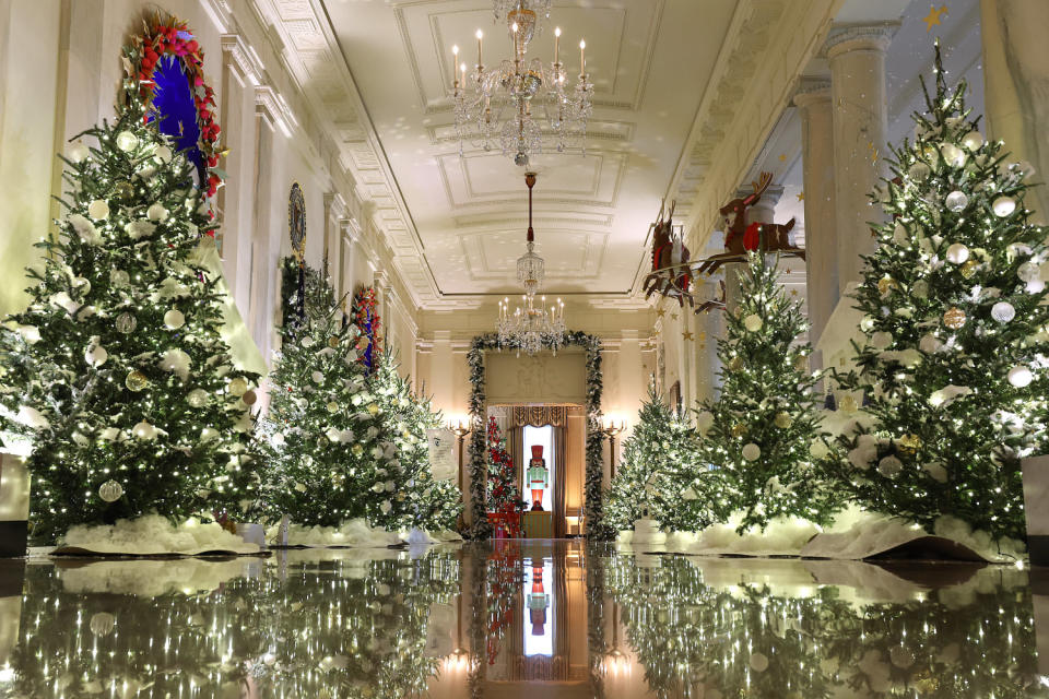 The Cross Hall between the East Room and the State Dining Room is lined with frosted Christmas tress during a media preview of the 2023 holiday decorations at the White House Nov. 27, 2023 in Washington, DC.  (Kevin Dietsch / Getty Images)