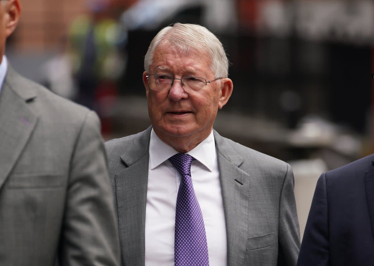 Sir Alex Ferguson arriving at Manchester Crown Court to give evidence in the trial of Ryan Giggs (PA) (PA Wire)