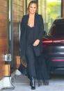 <p>Chrissy Teigen is in good spirits as she steps out in all black in Los Angeles on Jan 21.</p>