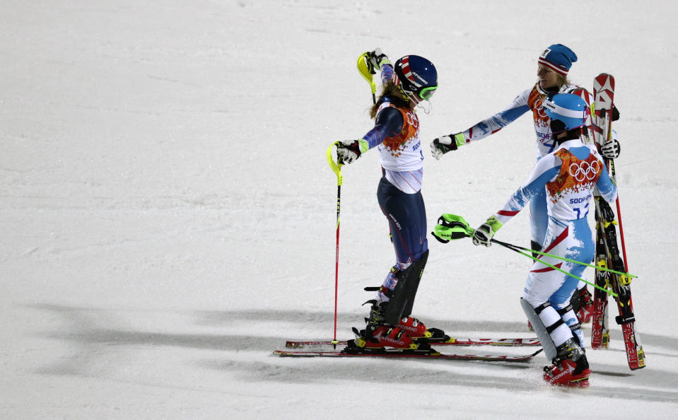 Women's slalom gold medalist, United States' Mikaela Shiffrin, left, is congratulated by Austria's Marlies Schild (silver), and Kathrin Zettel (bronze) at the Sochi 2014 Winter Olympics, Friday, Feb. 21, 2014, in Krasnaya Polyana, Russia.(AP Photo/Charles Krupa)