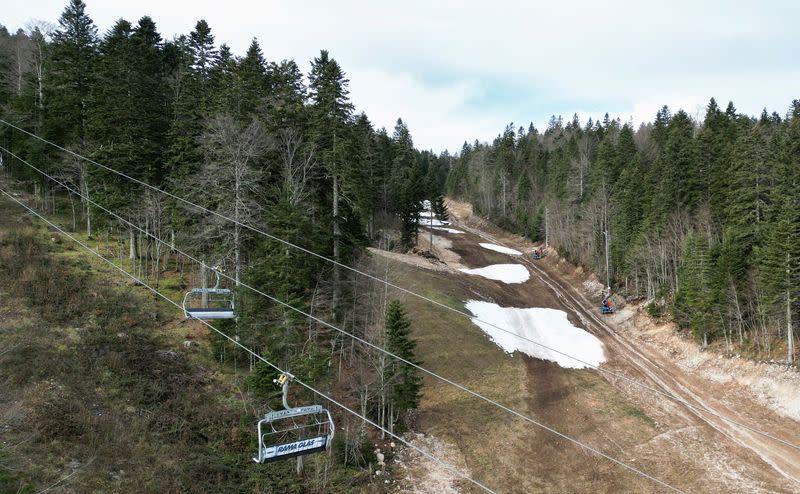 FILE PHOTO: Melting snow on a ski slope at a ski center in Bjelasnica