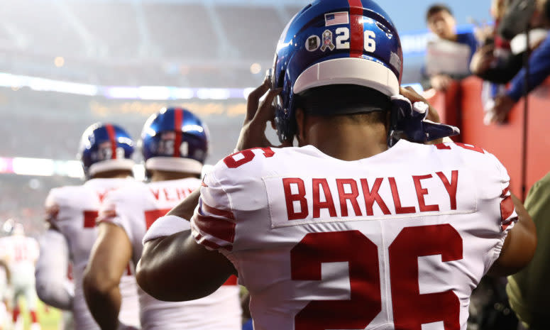 Saquon Barkley walking onto the field for the New York Giants in 2018.