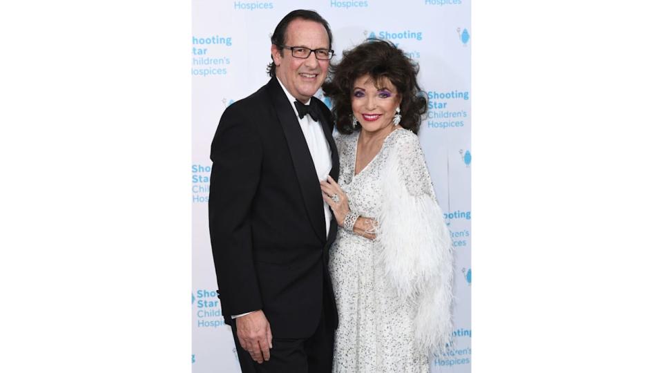 Percy Gibson and Dame Joan Collins attends the Shooting Star Ball in 2021. 