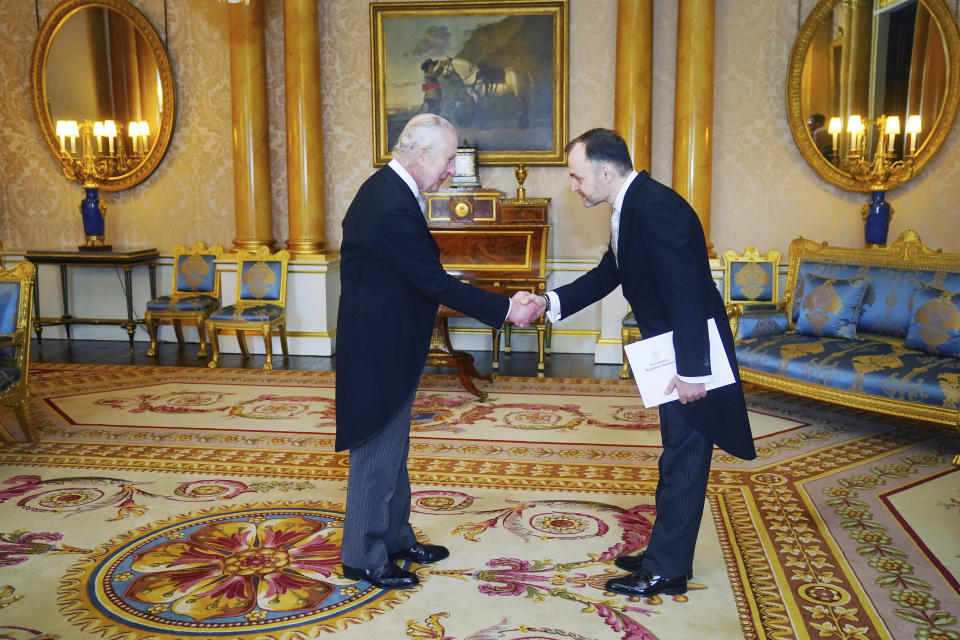 Ambassador of Moldova, Ruslan Bolbocean presents his credentials to Britain's King Charles III, left, during a private audience at Buckingham Palace, London, Thursday March 28, 2024. (Victoria Jones/Pool Photo via AP)